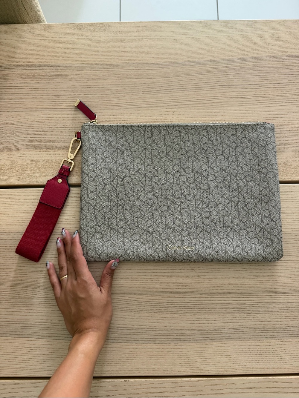 Calvin Klein Beige Monogram Clutch with Red Strap